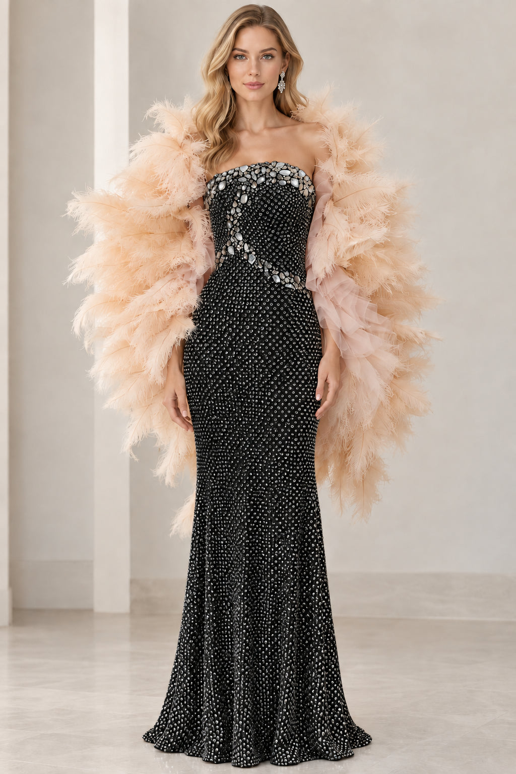 Front view of black strapless rhinestone evening gown paired with plush feather shawl