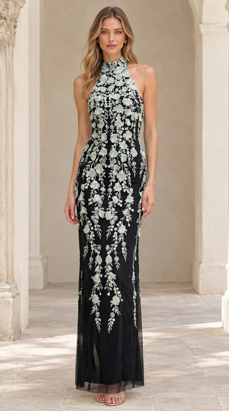 Model wearing Black floral embroidered halter maxi formal dress