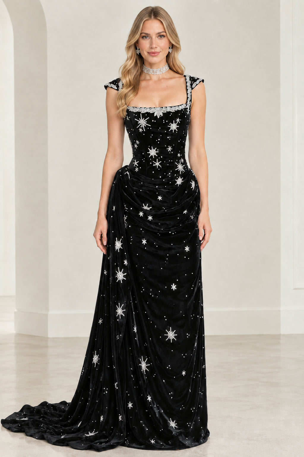 Black velvet evening gown with star embroidery and beaded neckline