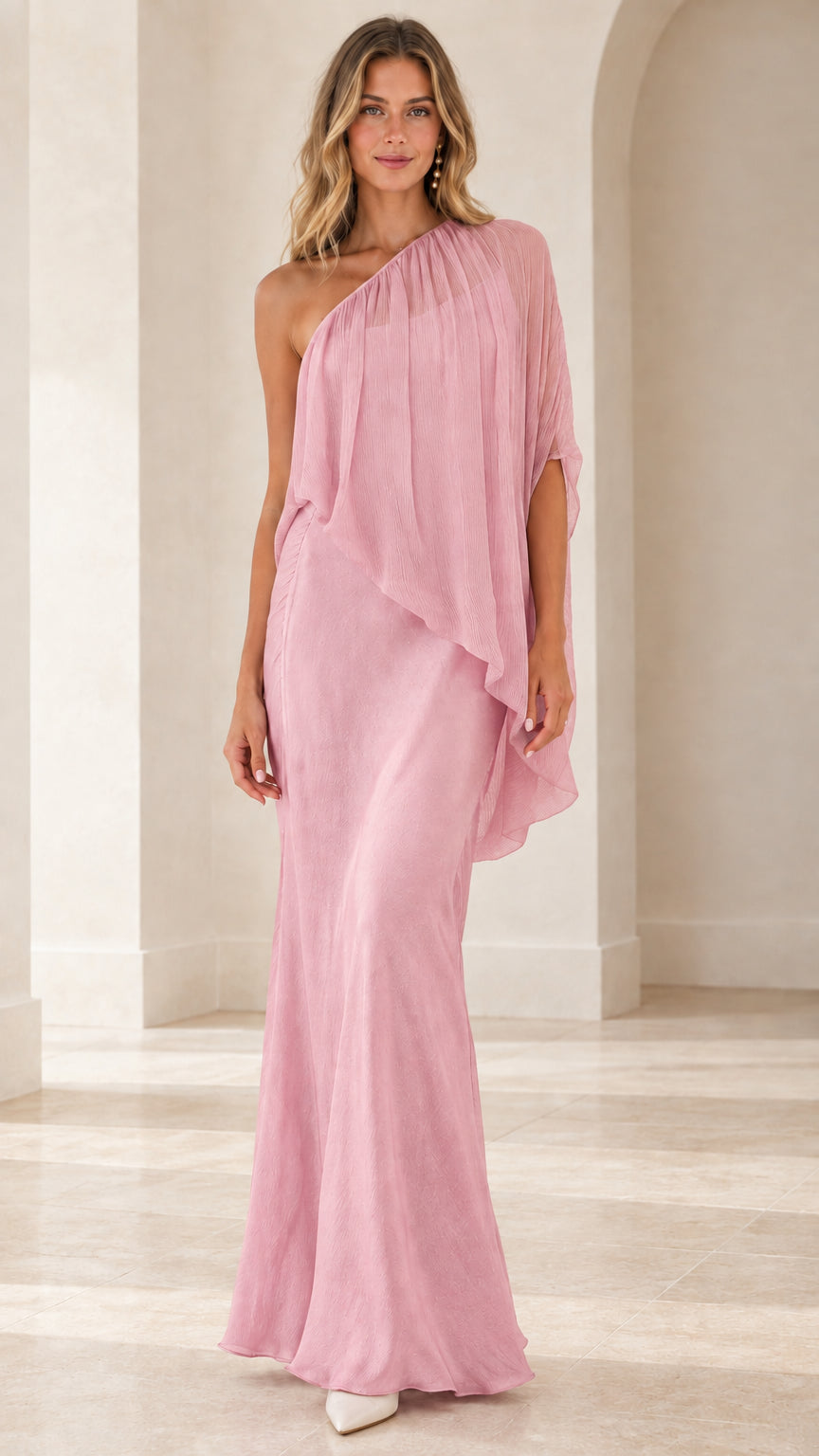 Model wearing blush pink one-shoulder flowing formal gown