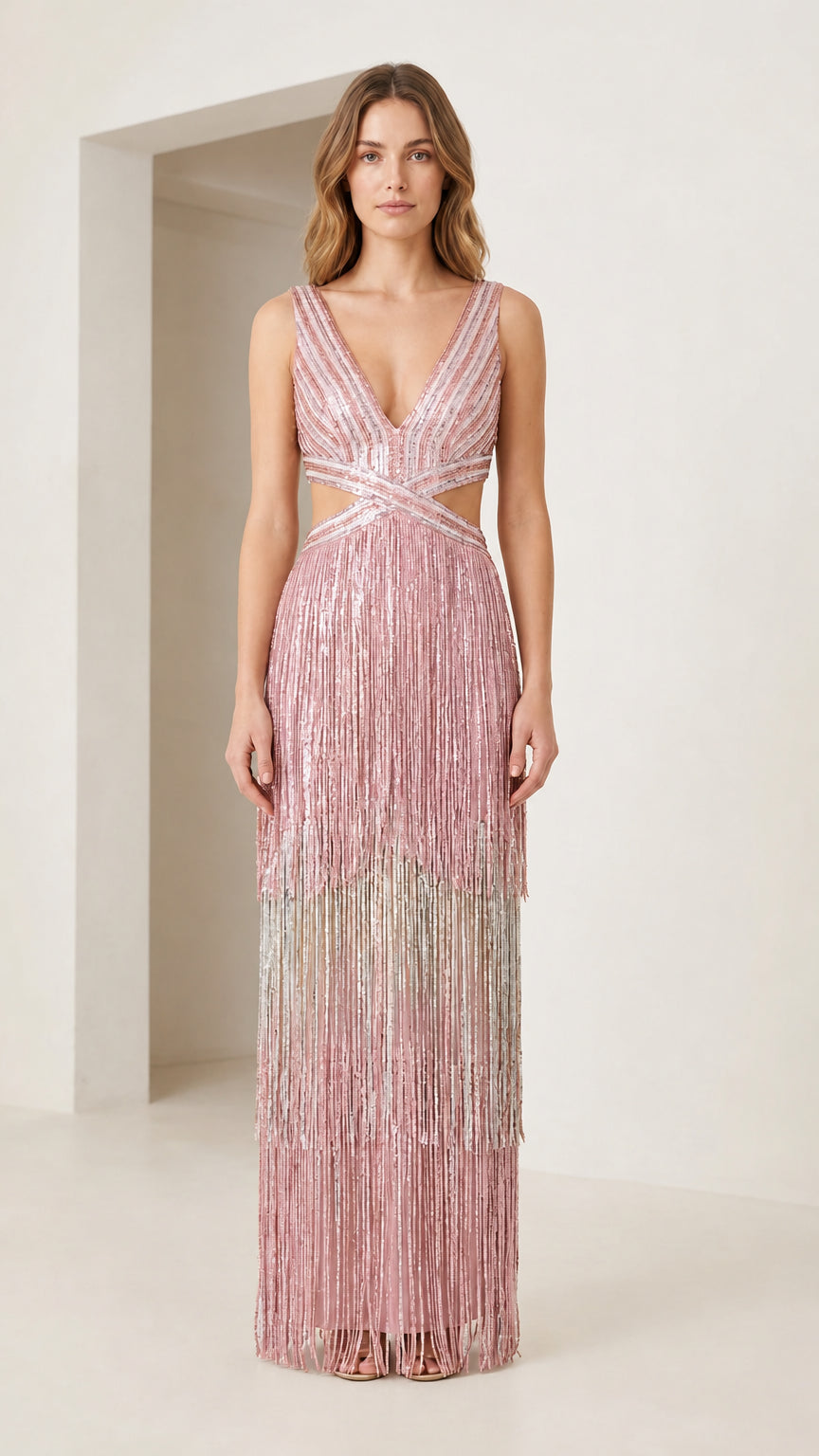 Front view of blush pink tiered metallic fringe cutout maxi dress