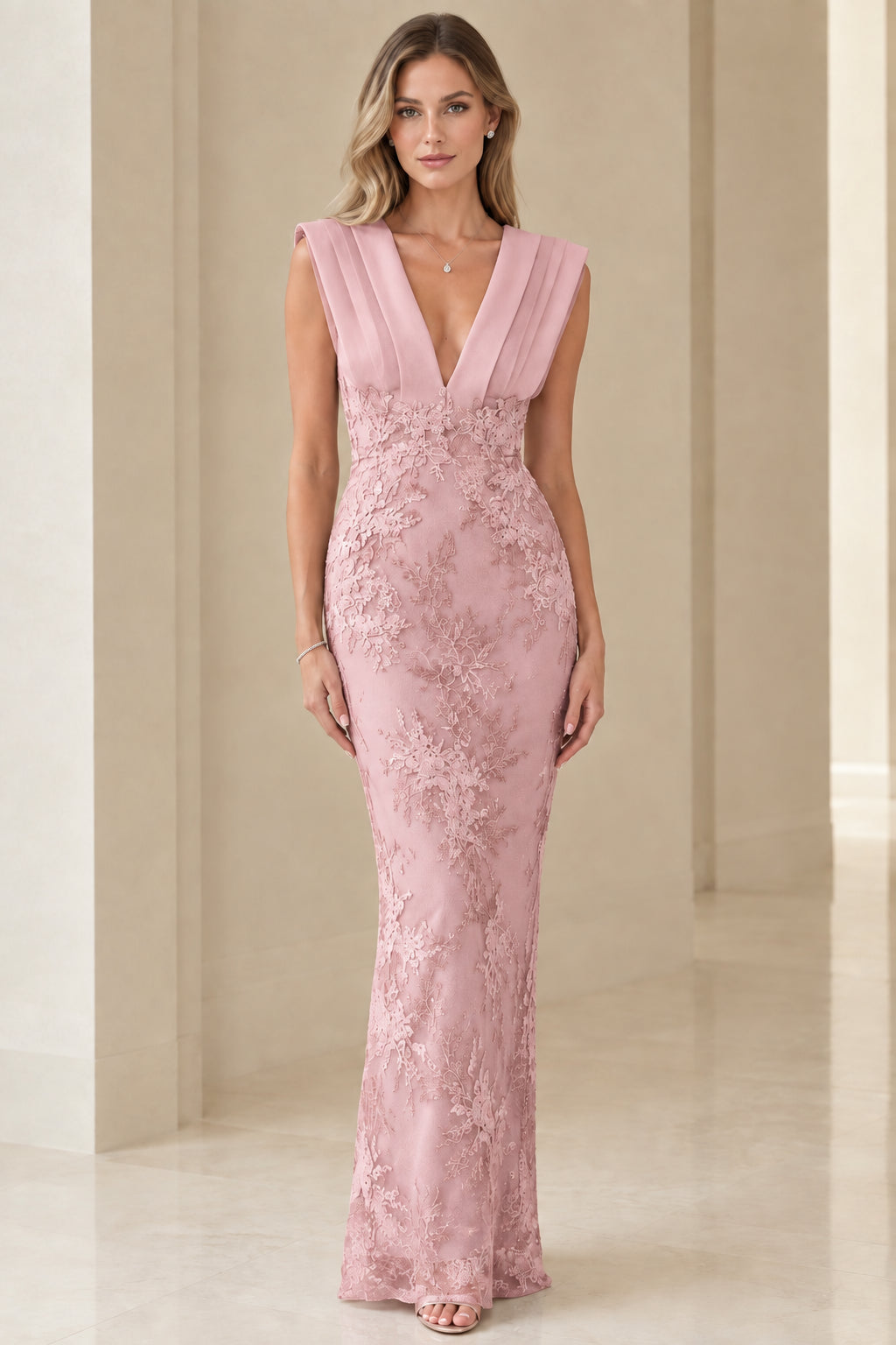 Model wearing blush pink corded lace pleated V-neck formal dress