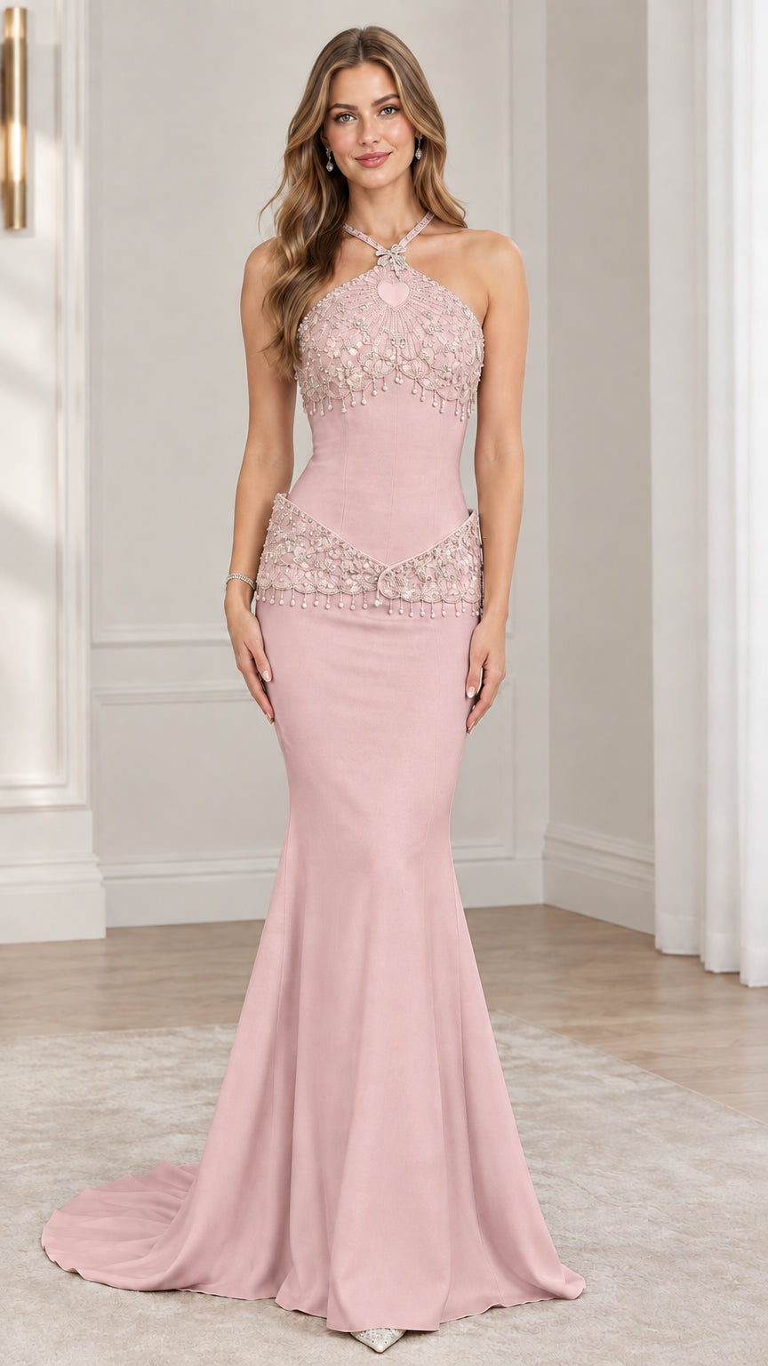 Front view of model wearing blush pink halter beaded mermaid evening gown