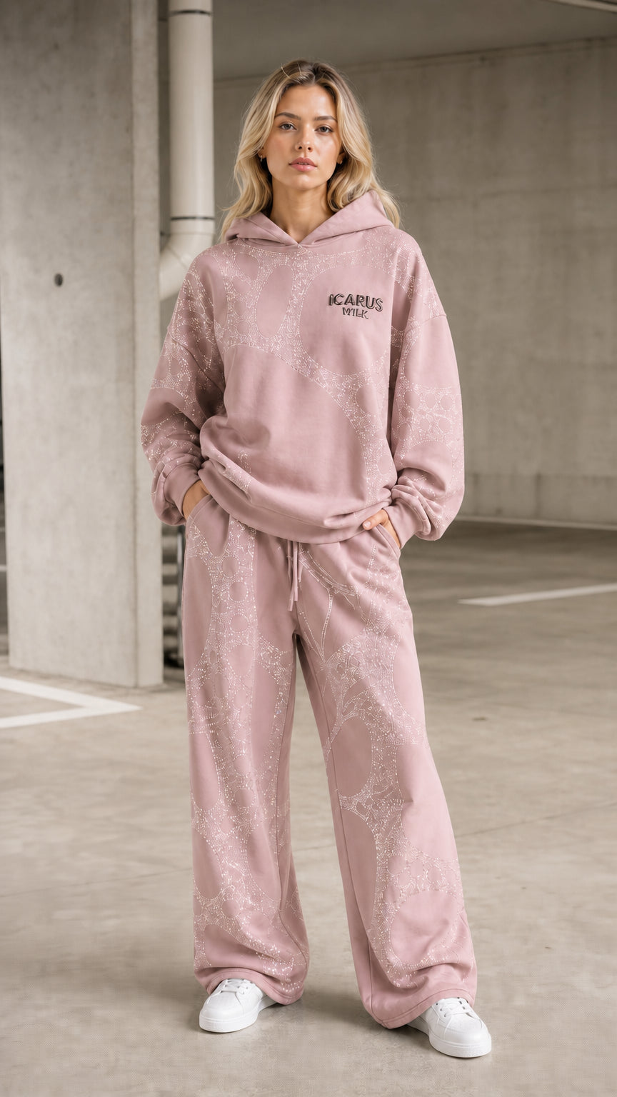 Front view of model wearing pink rhinestone hoodie and pants set