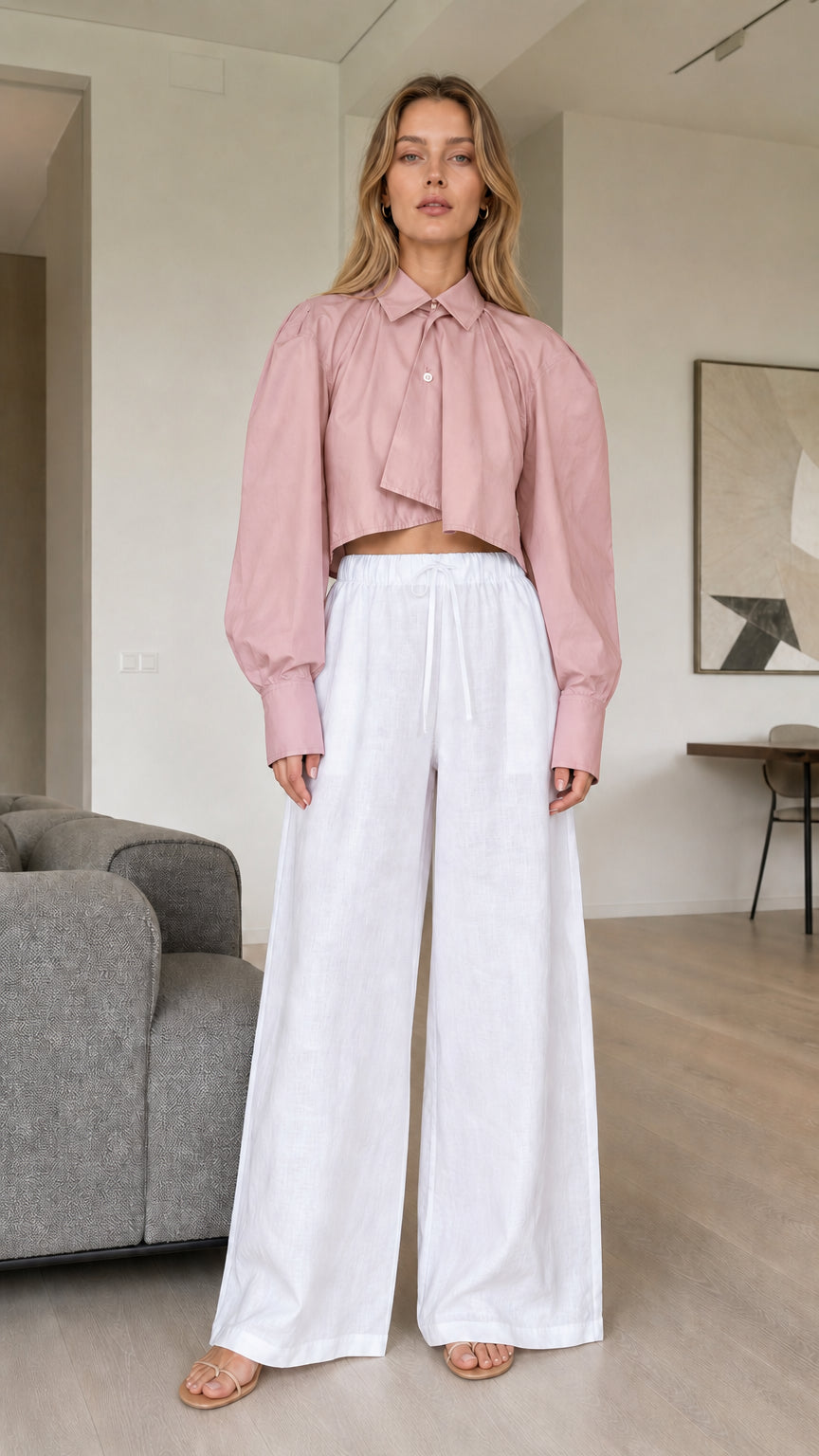 Model wearing dusty pink cropped pleated blouse