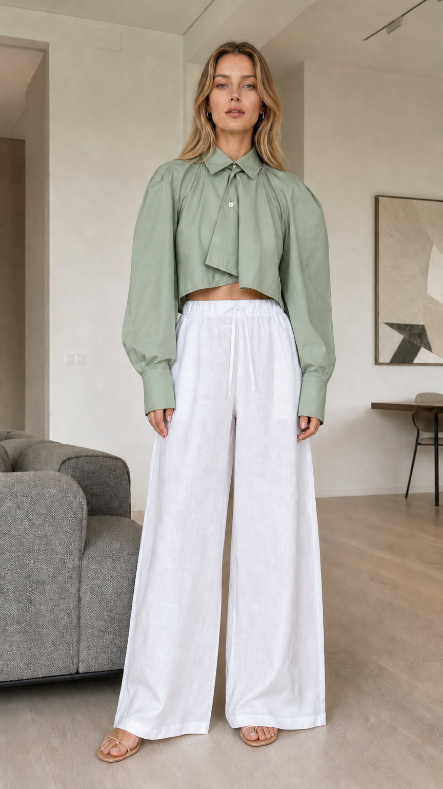 Model wearing sage green cropped pleated shirt