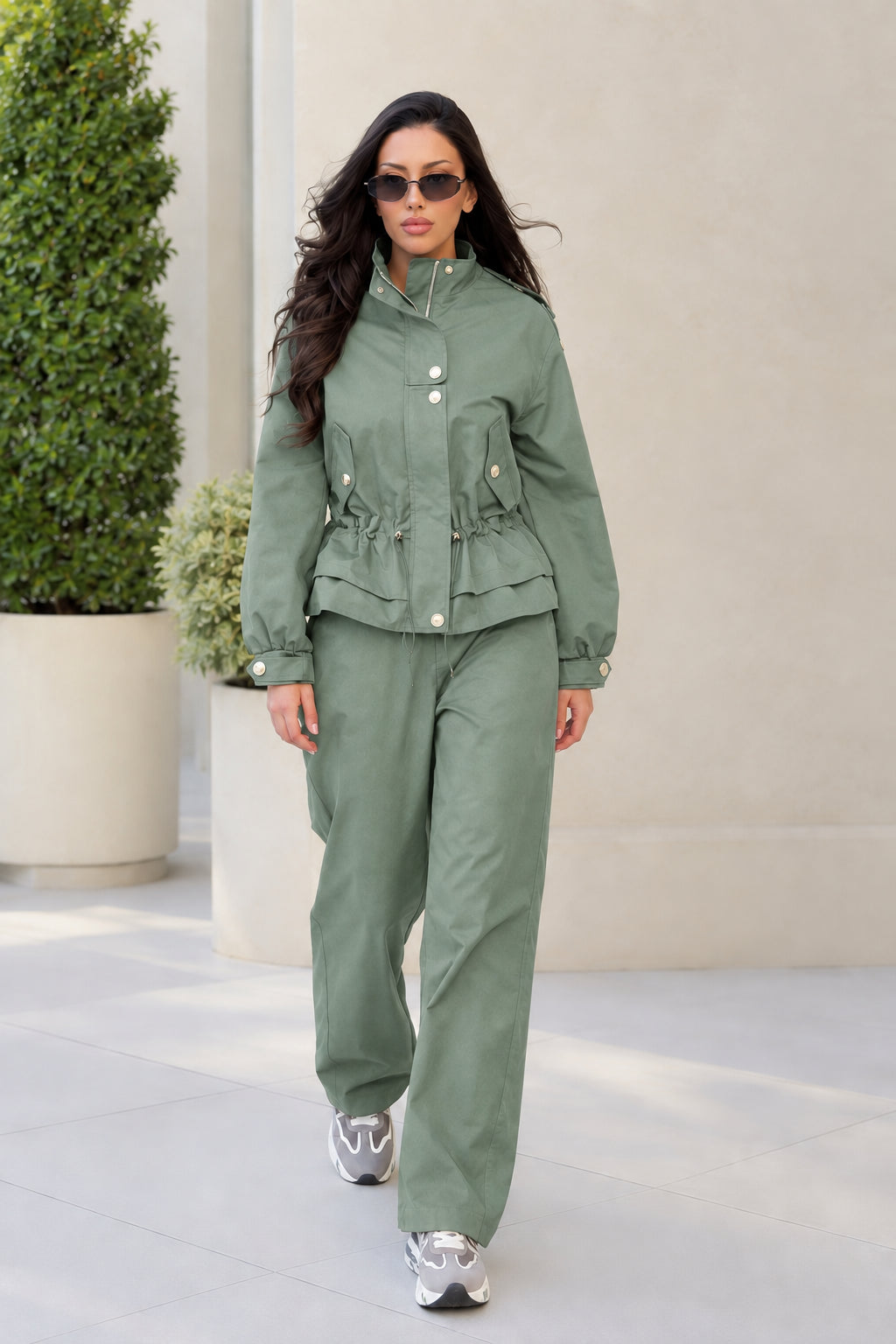 Front view of model wearing Sage Green matching utility jacket and relaxed pants set