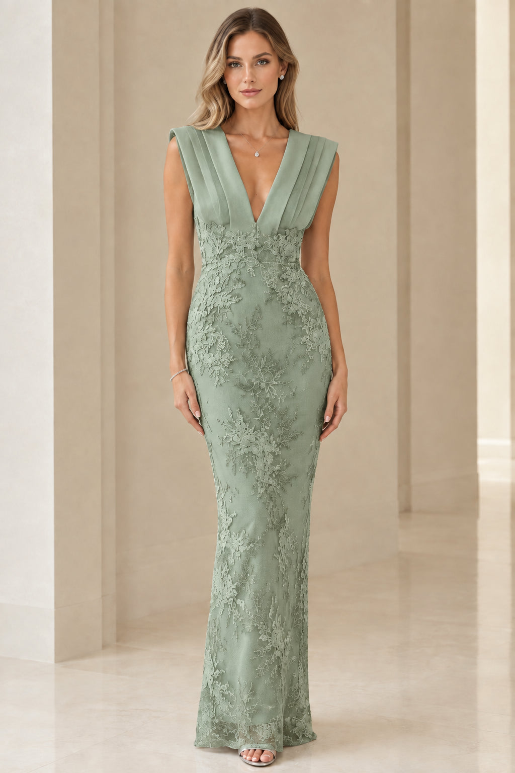Model wearing sage green corded lace pleated V-neck floor-length gown