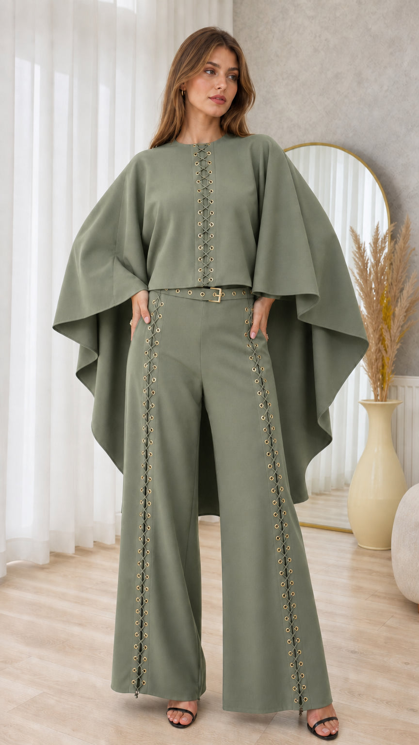 Front full-length view of sage green cape sleeve top and grommet wide-leg trousers set