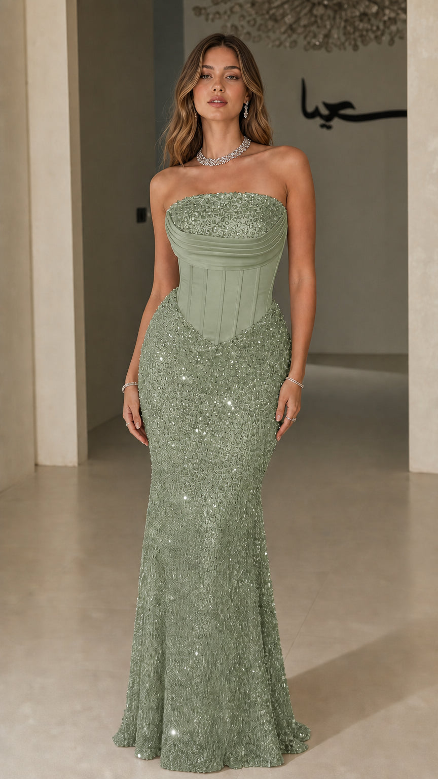 Front view of model wearing Sage Green strapless corset sequin maxi gown