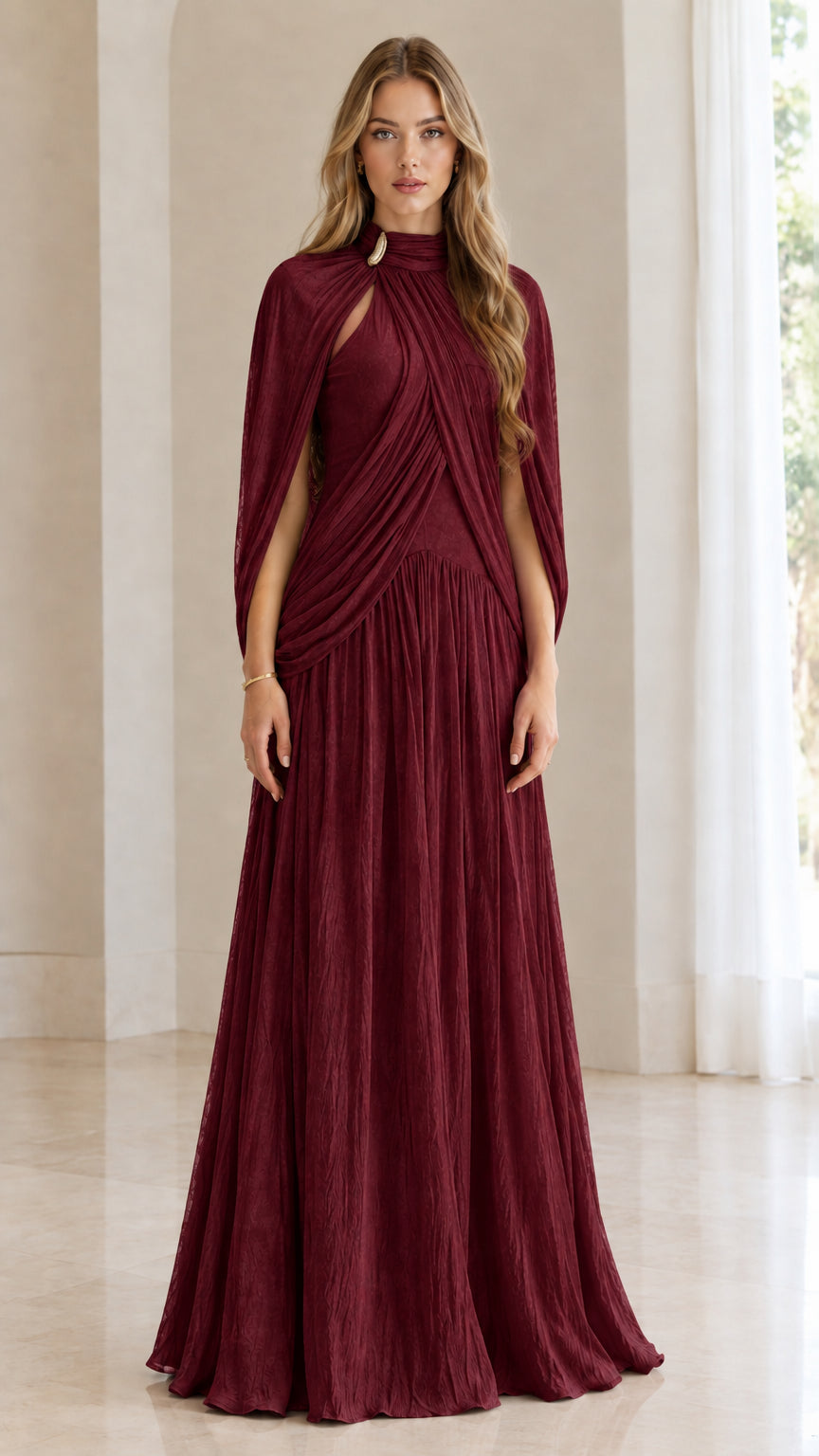Front full-length view of woman wearing burgundy wine pleated cape-sleeve maxi dress