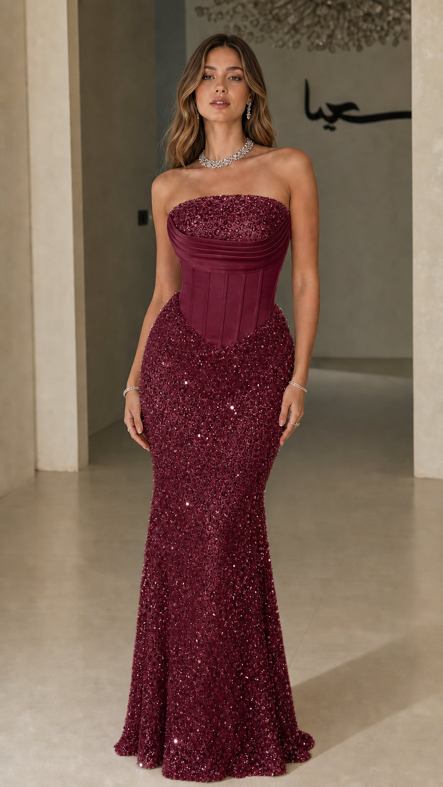 Front view of model wearing Burgundy wine strapless corset sequin evening dress