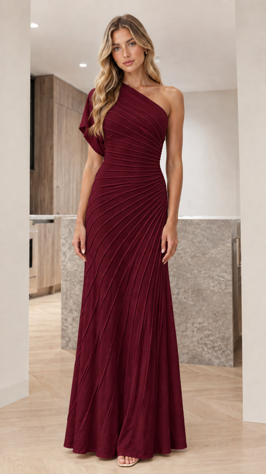 Front view of woman wearing burgundy wine one-shoulder pleated evening gown