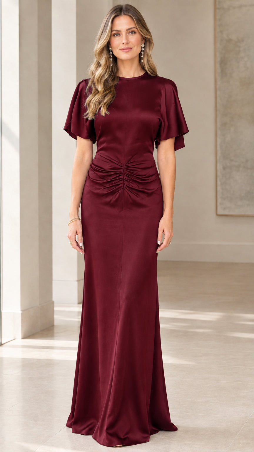Model wearing rich Burgundy wine flutter sleeve ruched satin evening gown