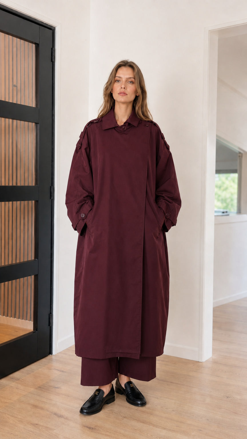 Front full view of woman wearing burgundy wine oversized maxi trench coat