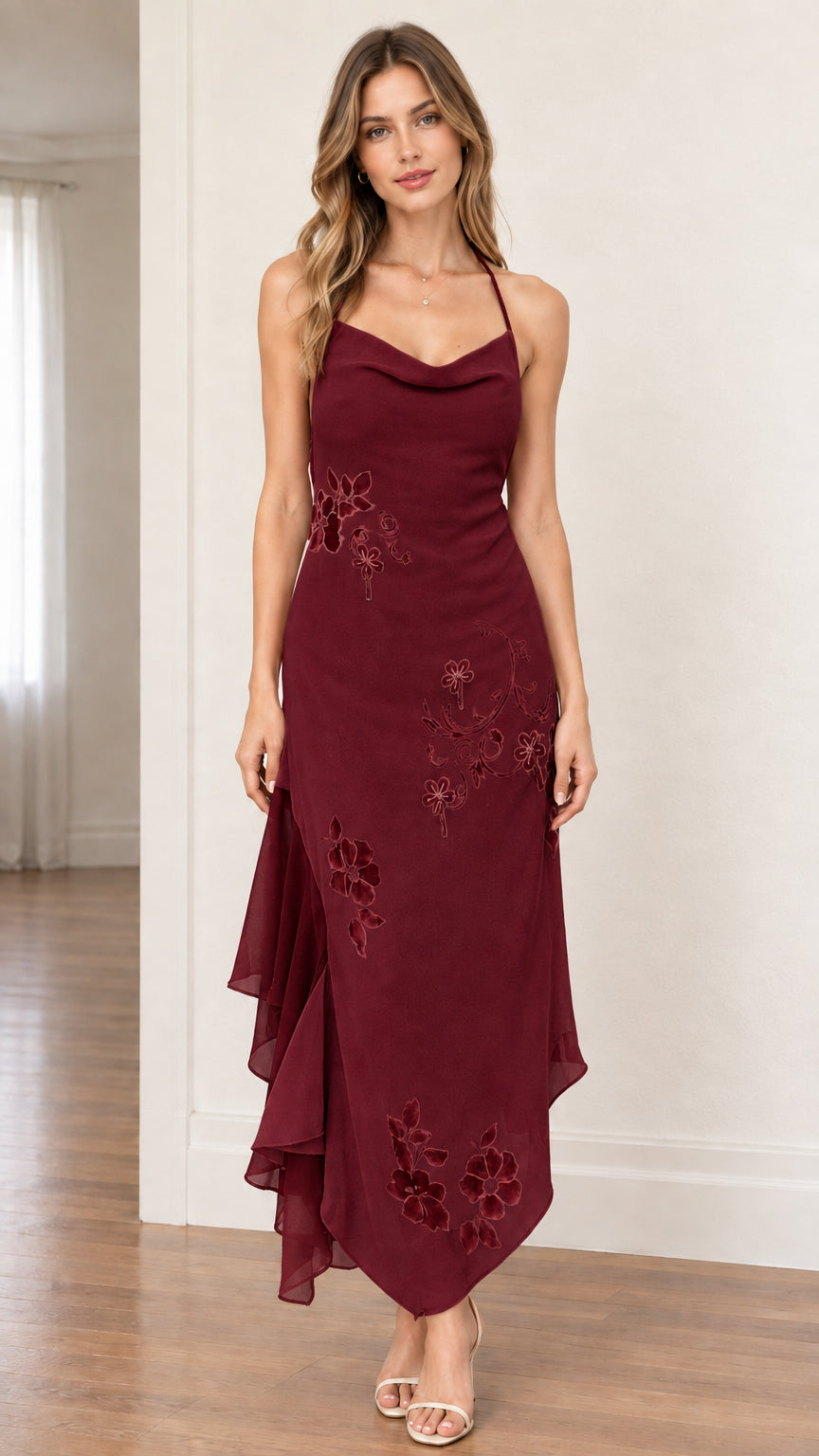 Model wearing rich burgundy halter cowl neck asymmetrical evening midi dress