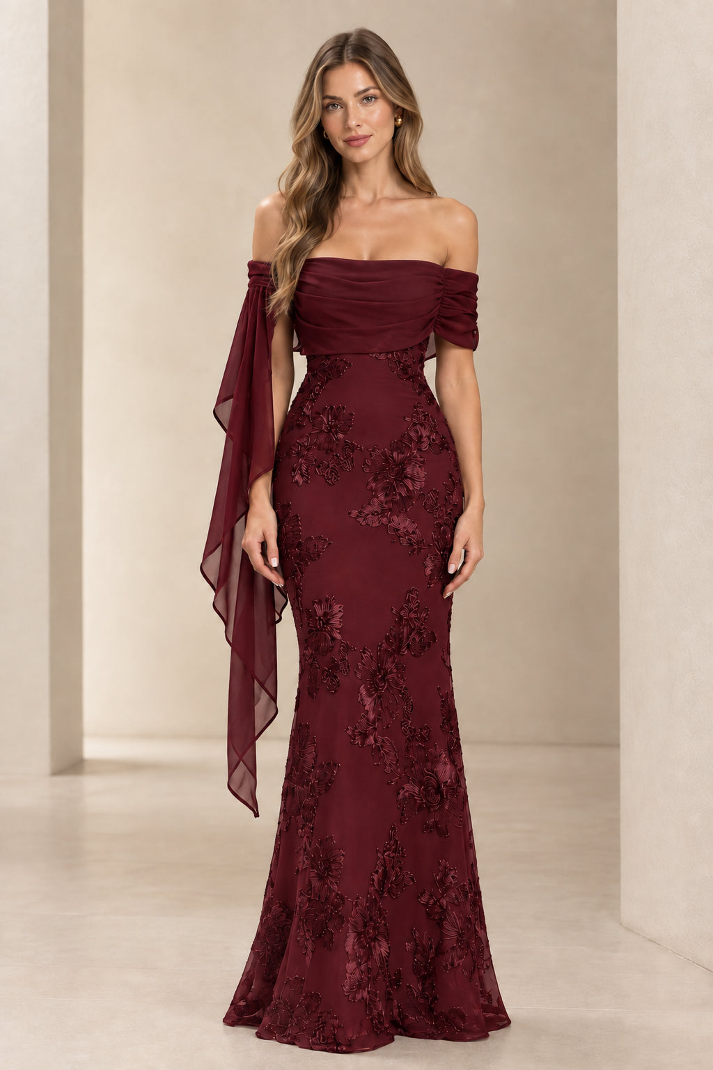 Model wearing burgundy wine red off-the-shoulder lace embroidered evening dress