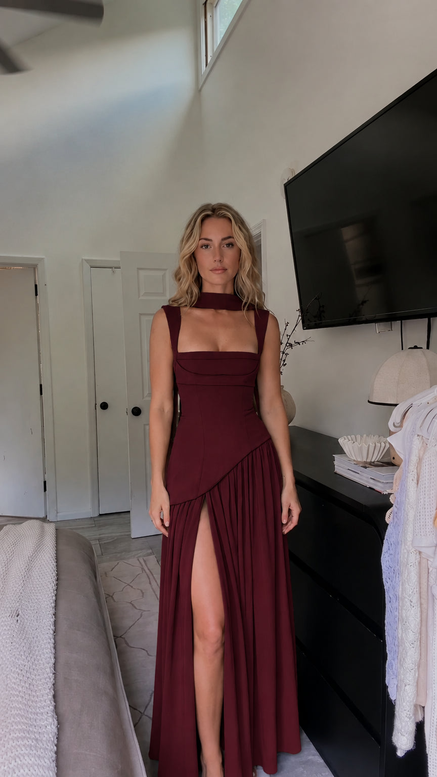 Front view of model wearing burgundy wine red choker neck pleated maxi dress