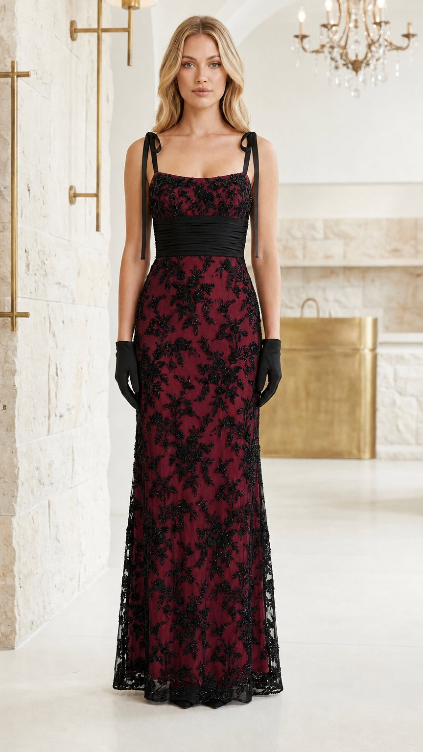Model wearing black floral sequin lace maxi dress with burgundy red lining