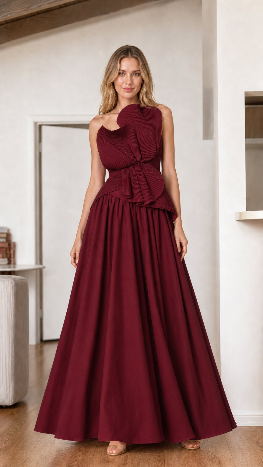 Burgundy strapless evening gown with drop-waist pleated design