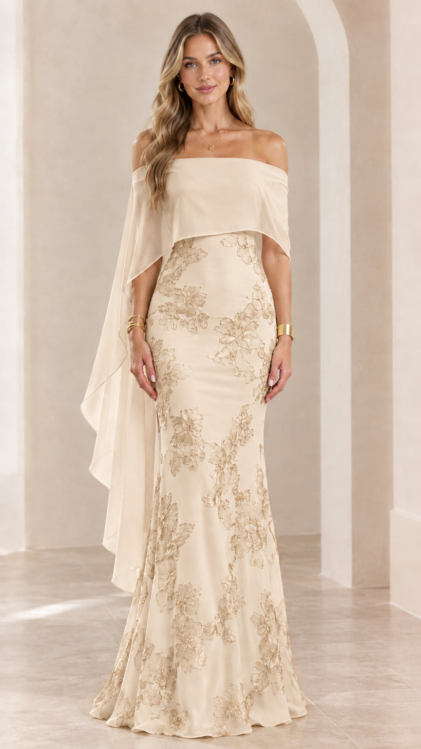 Woman wearing champagne off-the-shoulder embroidered cape evening gown