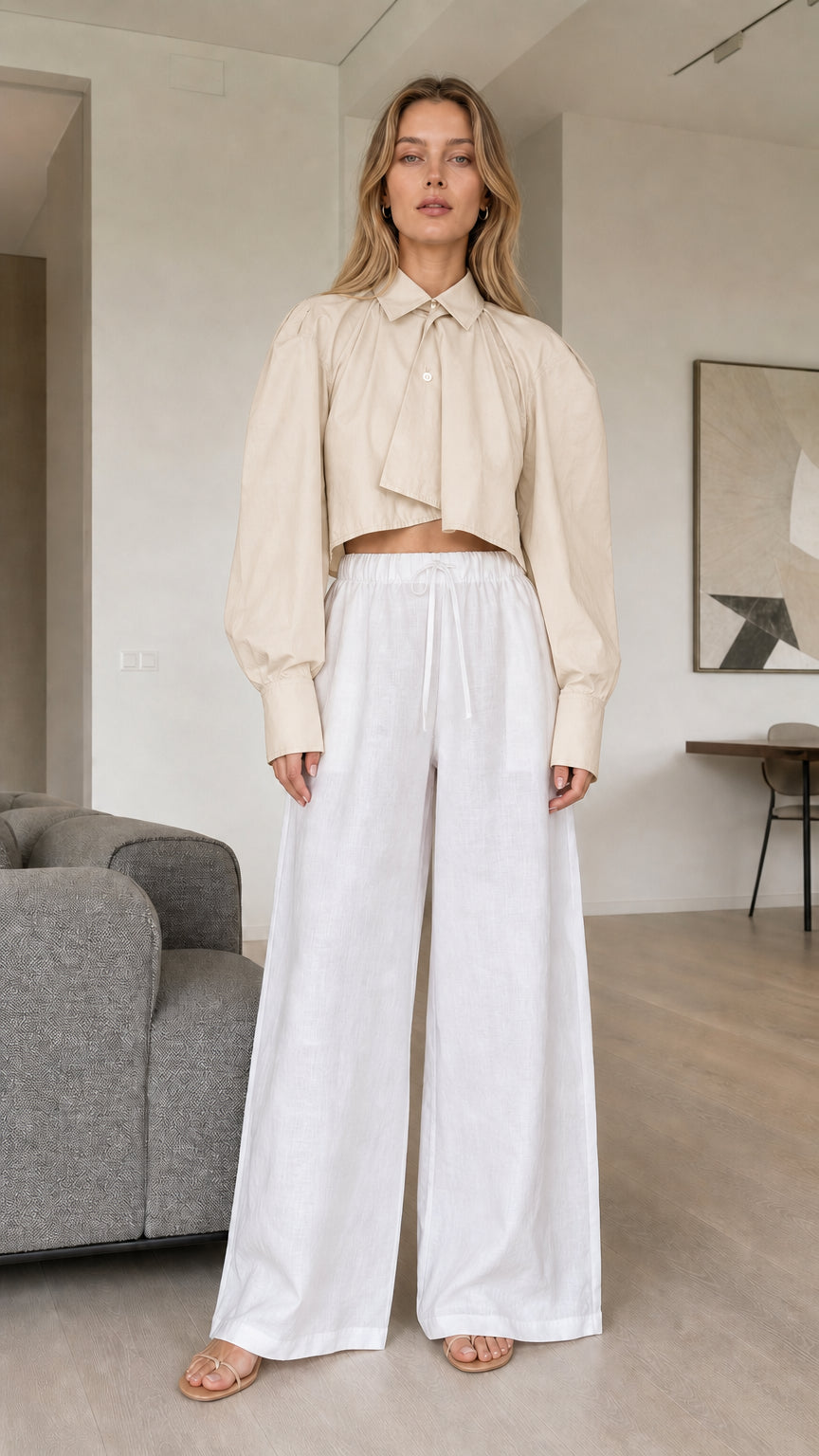 Model wearing beige cream cropped long sleeve shirt
