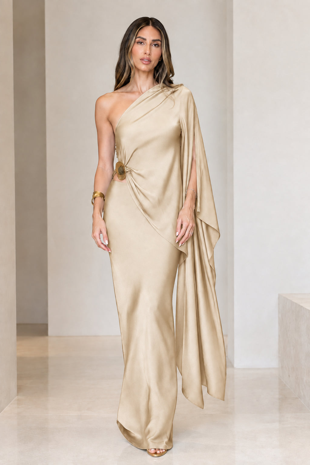 Front view of model wearing champagne gold one-shoulder draped satin maxi dress