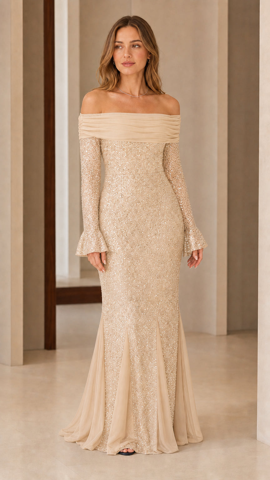 Front view of woman wearing champagne gold off-the-shoulder sequin mermaid gown