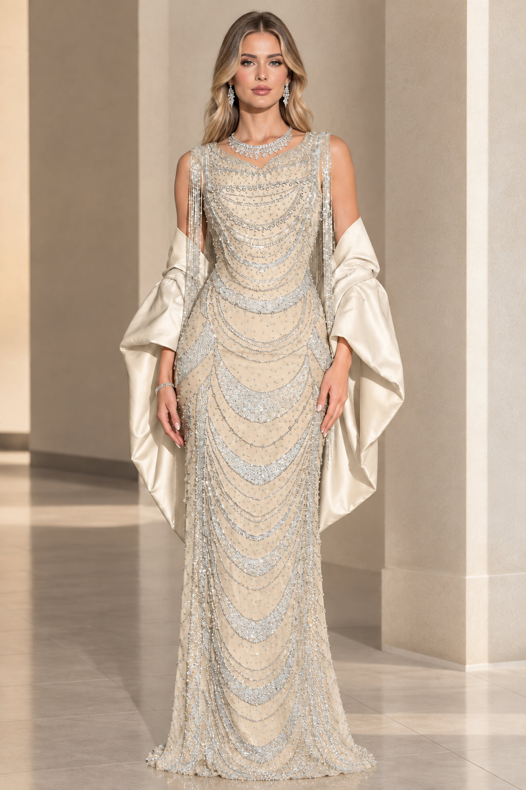 Front view of ivory gold embellished evening gown with champagne shawl