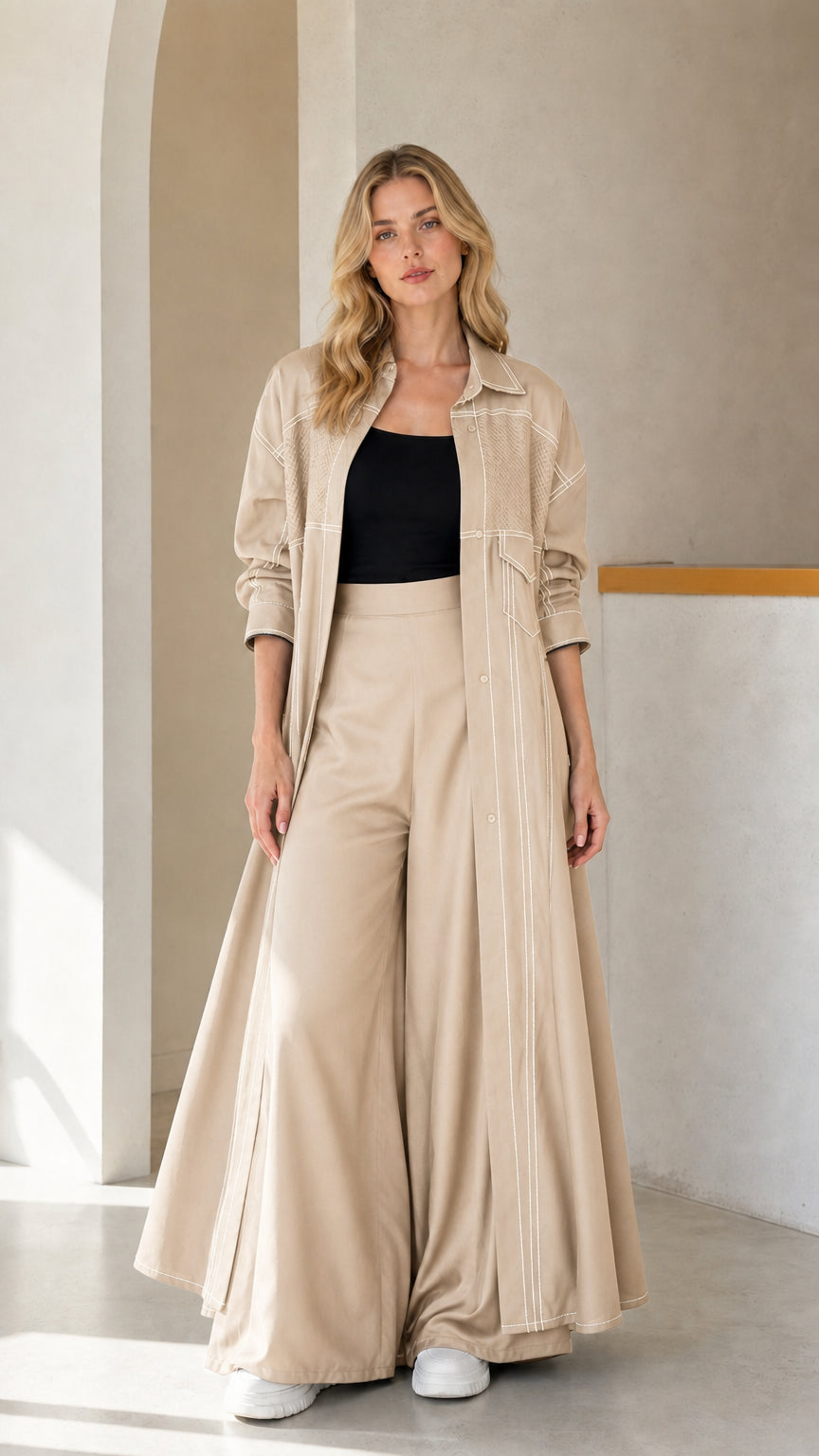 Full-length look of woman wearing Beige maxi duster coat and matching wide-leg pants