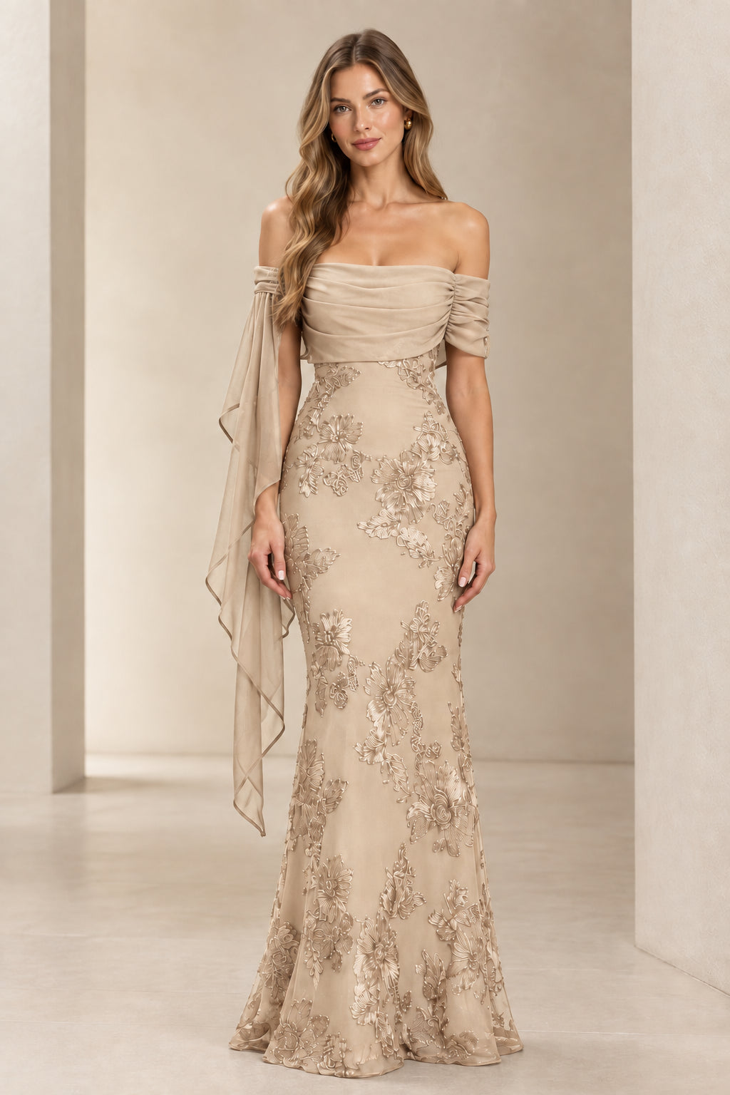 Model wearing champagne beige off-the-shoulder floral lace embroidered maxi gown