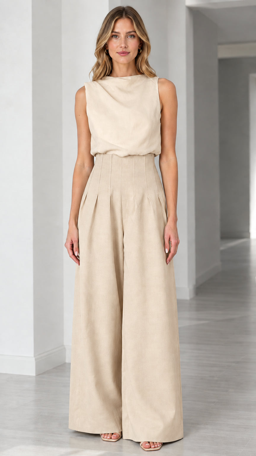 Full-length view of solid beige sleeveless wide-leg pleated jumpsuit